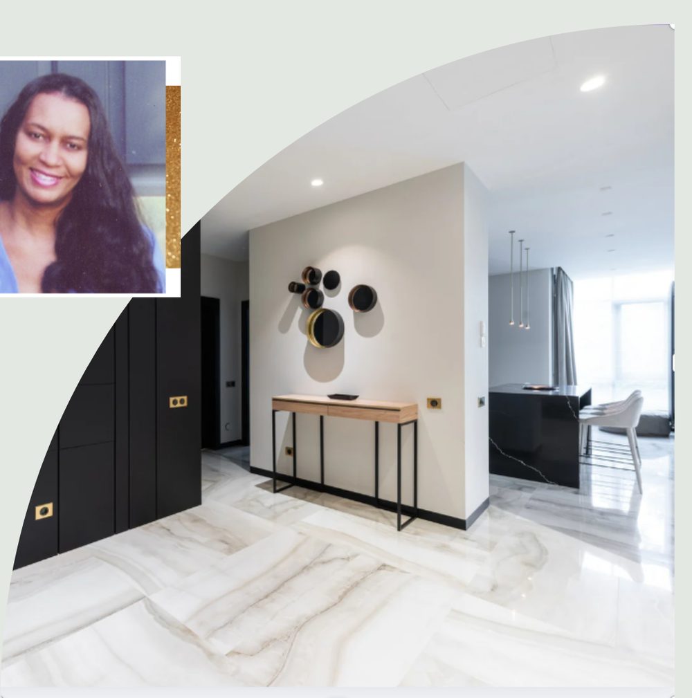 Modern entry hall designed by Holland Interiors: black cabinetry, marble floor, gold hardware